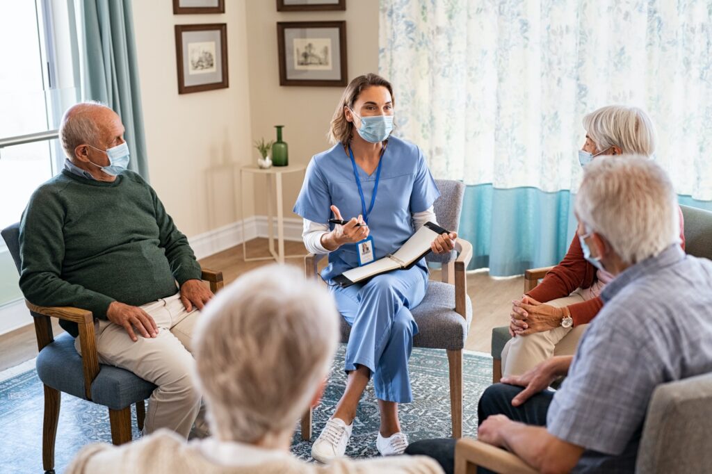 Self help therapy group meeting in nursing home during covid